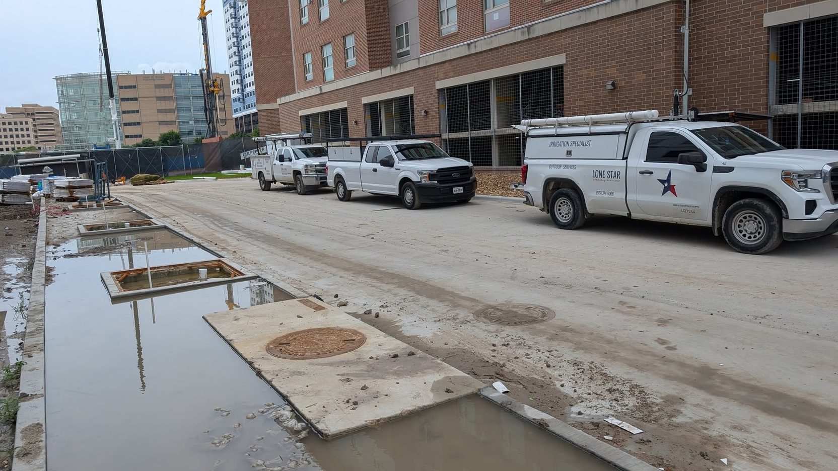Lone Star trucks on a commercial property during an irrigation job