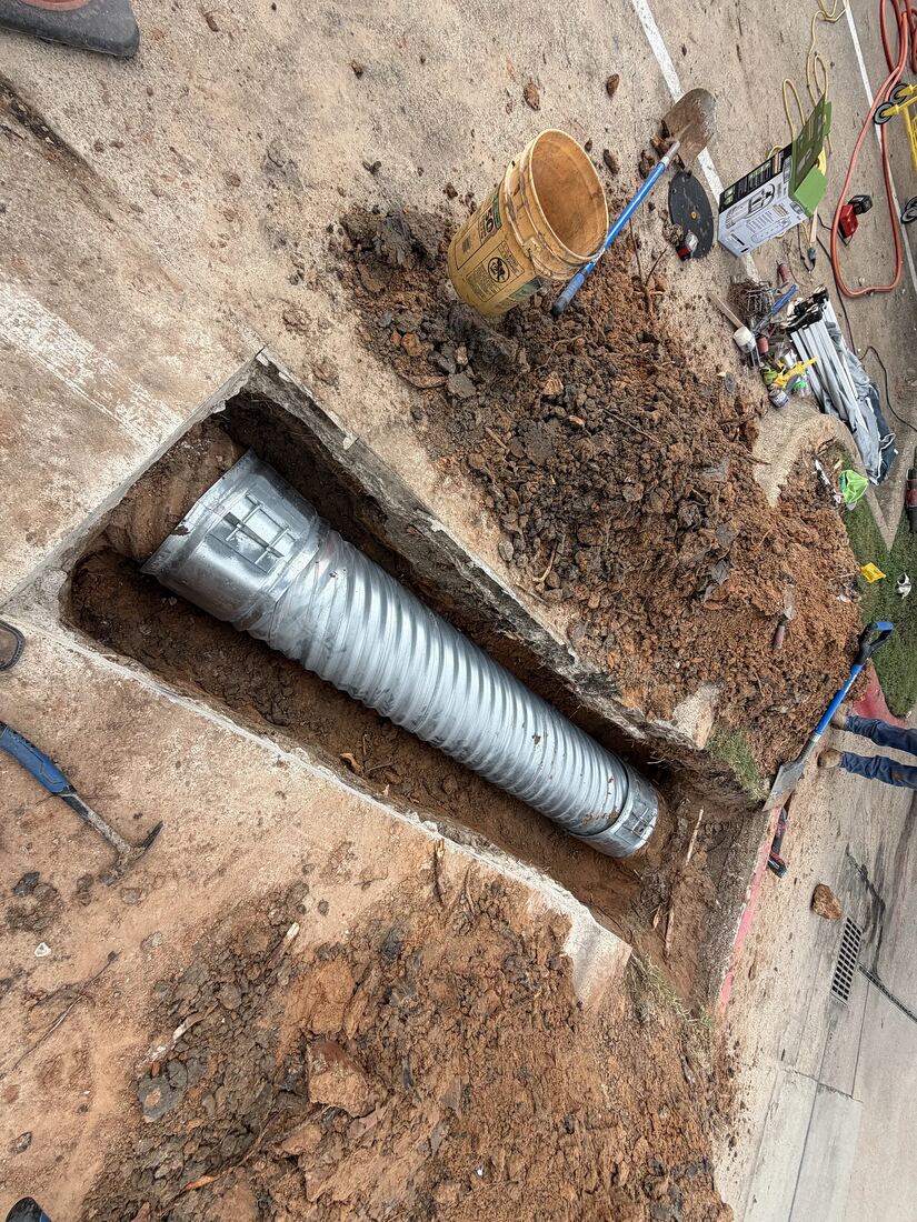 Drainage pipe bedded in an excavated trench