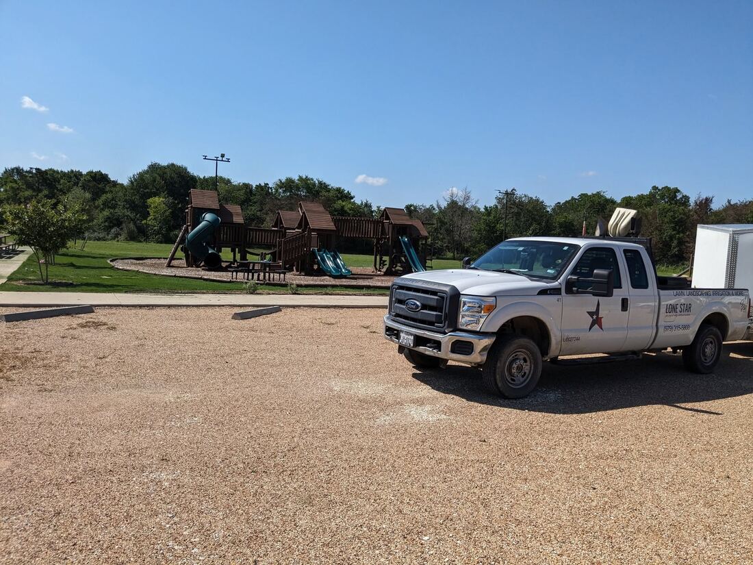 Lone Star maintenance truck on a commercial grounds job in the Brazos Valley