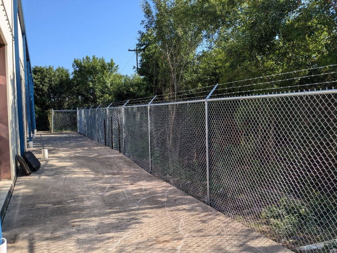 Chain link fence enclosing a commercial yard