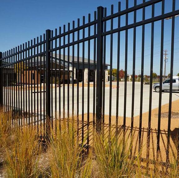 Black ornamental iron fence with open sight lines