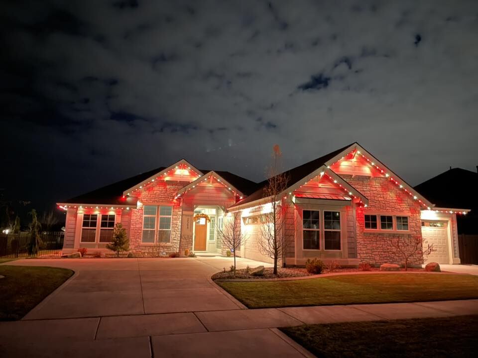 Christmas lighting on a home at night
