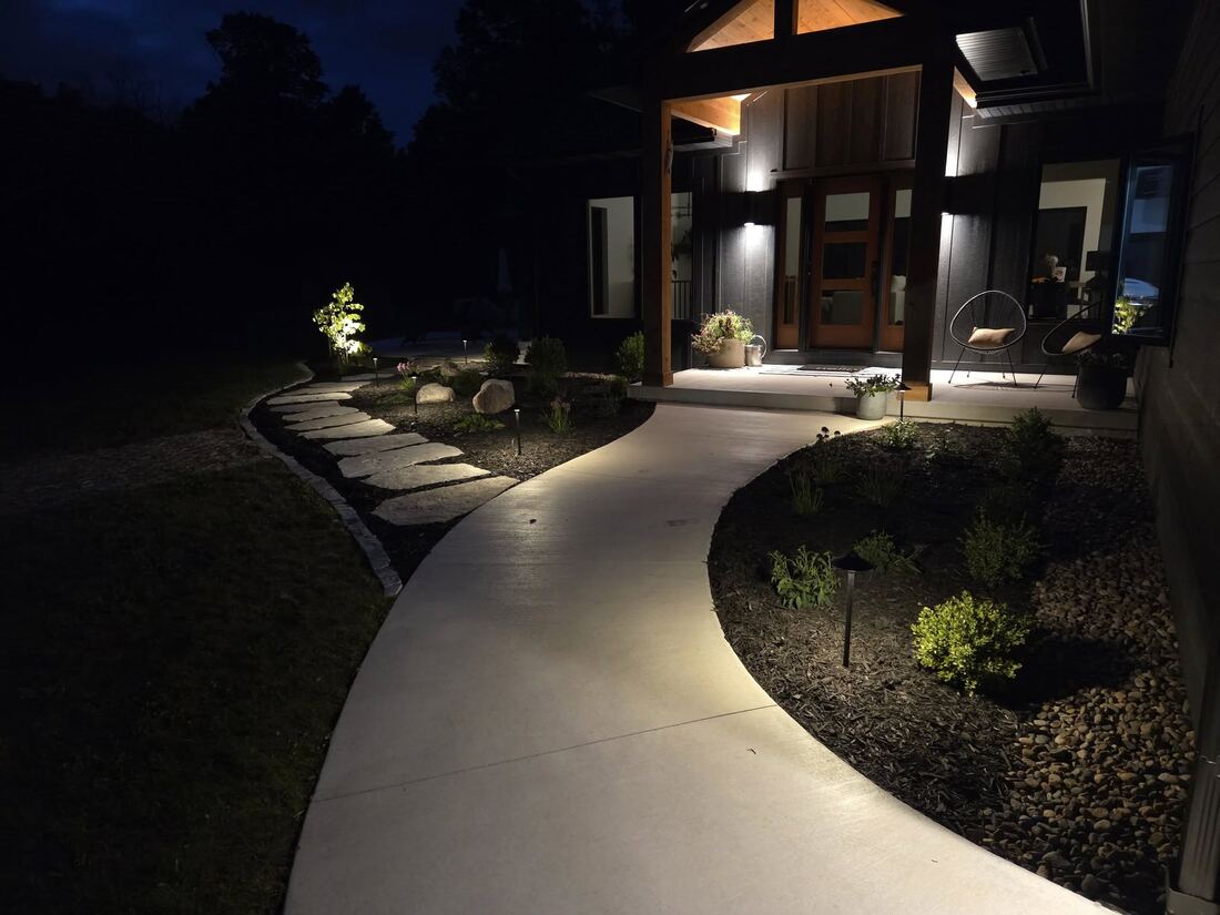 Path lighting along a walkway at dusk