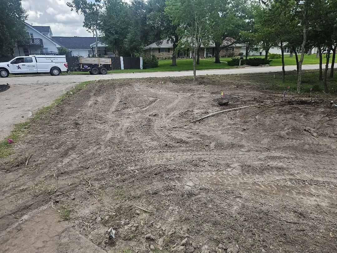 Graded bare lot ready for sod on a Brazos Valley property