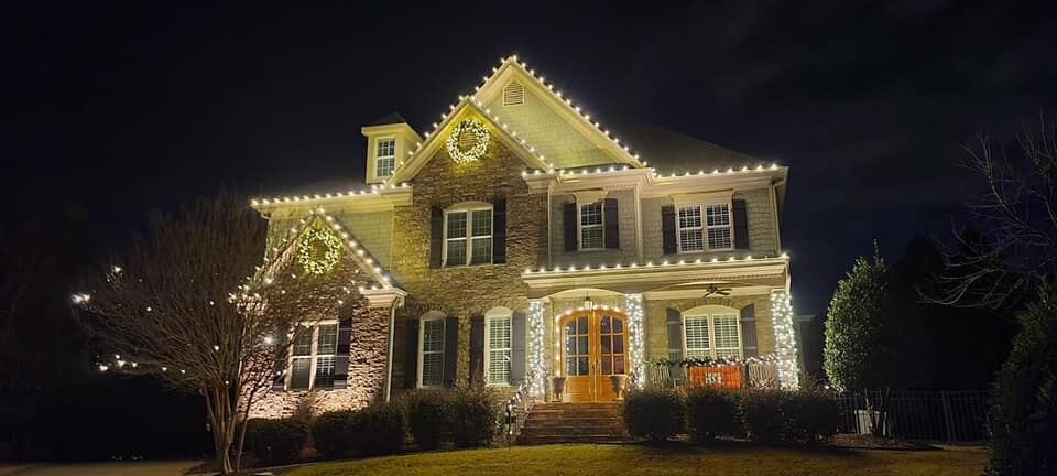 Roofline Christmas lighting across a wide single-storey home